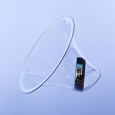 a cell phone is suspended from a clear object