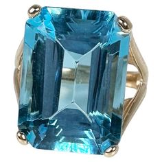 Large Swiss Blue topaz ring in 14KT yellow gold, a unique statement ring with a character. GOLD: 14KT gold NATURAL TOPAZ(S) Clarity/Color: Slightly Included/Swiss Blue Cut: Emerald Measurements:17x13mm Grams:7.85 size: 8 Item#: 200-00063KME WHAT YOU GET AT STAMPAR JEWELERS: Stampar Jewelers, located in the heart of Jupiter, Florida, is a custom jewelry store and studio dedicated to providing 100% satisfaction to each client. Our personal attention to detail, passion, affordability and honesty se Yellow Gold Rings With Blue Topaz And 17 Jewels, Yellow Gold Blue Topaz Rings With Emerald Cut, Yellow Gold Emerald-cut Blue Topaz Ring, Yellow Gold Emerald Cut Blue Topaz Rings, Emerald Cut Hallmarked Topaz Ring, Swiss Blue Topaz Ring, Jupiter Florida, Swiss Blue Topaz, Diamond Rings Bands