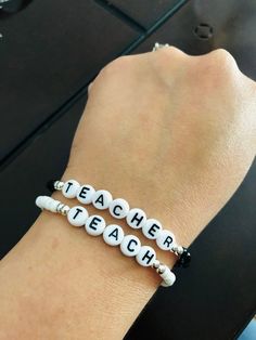 *This teacher bracelet would make a great gift for your child's teacher.* *Comes in two colors to choose from: black or white.* Teacher Bracelet, Boys Bracelets, Wood Bracelet, Teachers Day, Gift For Teacher, Name Bracelet, Pony Beads, Bead Jewelry, Best Teacher