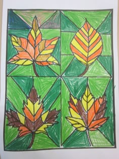 an art project with leaves drawn on paper and colored pencils in the shape of squares