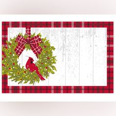 a christmas card with a wreath and cardinal on it