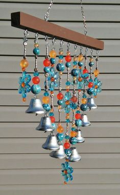 a wind chime with bells hanging from it's side