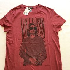 a red shirt with a man wearing sunglasses on it