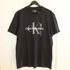 Calvin Klein Logo T-Shirt, Black, Crew Neck, Short-Sleeves, Calvin Klein Logo Across Chest, Size Men’s L (Large), Nwt (New With Tags), Never Worn Or Used. Calvin Klein Black T-shirt For Streetwear, Calvin Klein Logo Cotton Tops, Calvin Klein Cotton Tops With Logo, Calvin Klein Cotton Logo Tops, Calvin Klein Logo Print Crew Neck T-shirt, Calvin Klein Crew Neck T-shirt With Logo, Black Casual T-shirt With Logo, Calvin Klein Cotton Logo T-shirt, Calvin Klein Cotton T-shirt With Logo Print