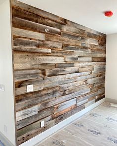 a wall made out of wooden planks in a room