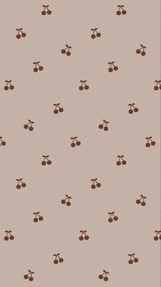 a brown and white wallpaper with cherries on it