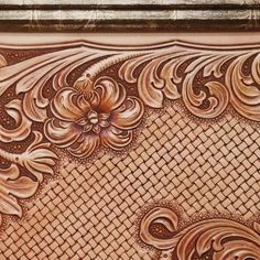 an intricately carved wood panel with flowers and leaves