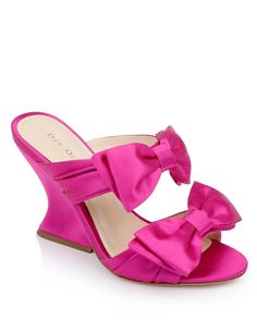 This asymmetric wedge is unafraid, offering a contoured heel shape and satin strap bows that can only be called luminous. In Burgundy, nothing will be able to stifle your spirit. Burgundy Sandals, Pink Mules, Bow Mules, Barbie Vibes, Wedge Mules, High Wedges, Mule Sandals, Authentic Self, Spring Summer 2024