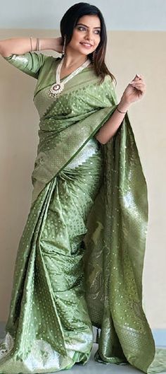 Green color Saree in Banarasi Silk fabric with Weaving, Zari work Unstitched Brocade Pre-draped Saree For Wedding, Brocade Pre-draped Saree For Wedding And Eid, Wedding Eid Brocade Pre-draped Saree, Wedding Brocade Pre-draped Saree For Eid, Green Traditional Wear With Motifs For Reception, Wedding Brocade Pre-draped Saree For Festivals, Green Banarasi Silk Dupatta For Reception, Pista Green Blouse Piece With Pallu For Wedding, Green Banarasi Silk Traditional Wear For Reception