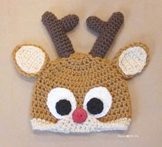 a crocheted deer hat with big eyes