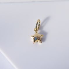 Hey! 👋🏼 You're a star, so let the world know with our unisex star charm. Add it to one of our necklaces or earrings to make a look that's uniquely you. Precious Metal: 14K Solid Yellow Gold Measures: 7.2mm Bale size: 7 x 4.9mm Chain: This charm does not come with a chain, but it does come with an attached bale to fit in most of chains. Other pieces shown on the pictures are sold separately. Comes in our beautiful gift box ***Note: Prices and availability are subject to change without notice. F Earrings To Make, Gold Star Pendant, Yellow Gold Chain, Dress Jewelry, Gold Star, Precious Metal, Gold Jewelry Fashion, Star Charms, Star Pendant