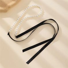 Trend Wedding Party Jewelry Long Black Ribbon Choker Necklace For Women Elegant White Imitation Pearl Beach Vacation Necklaces Necklace Type: Chains Necklaces Material: PEARL Pearl Type: Simulated-pearl Gender: Women Model Number: r6r Style: TRENDY Shape\pattern: Round Fine or Fashion: fashion Occasion: Anniversary Item Type: NECKLACES Compatibility: All Compatible Choice: yes semi_Choice: yes Elegant Black Beaded Pearl Necklace, Elegant Black Pearl Necklace With Charm, Elegant Black Pearl Necklace For Weddings, Elegant Black Beaded Necklace With Pearl Charm, Chic Pearl Beaded Necklaces For Party, Party Clavicle Chain Pearl Necklace With Round Beads, Party Adjustable Beaded Pearl Necklace, Adjustable Black Pearl Chain Jewelry, Black Pearl Jewelry With Pearl Charm