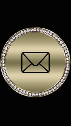 a gold button with an email symbol on the bottom and diamond trim around the edges