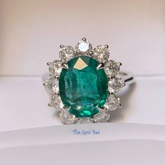 Absolutely stunning Zambian emerald 18k white gold ring! The emerald is from Zambia, beautiful rich green color and good clarity for its size. There are 1.77 carats of sparkly white diamonds adorning the ring! This ring comes with one certification: Gemological Institute of America (GIA) Ring Size: 7 Total Weight: 6.21 grams Precious Metal: 18k gold Precious stones: -Emerald Center Stone: 4.26 carats, 12.1mm x 9.5mm -White Diamonds: 1.77 carats Hallmark: 750 CS 4.26 D1.77 21 Grams, Solid Gold Ring, Zambian Emerald, Rich Green, Solid Gold Rings, Precious Metal, Emerald Diamond, Ring Ring, White Diamonds