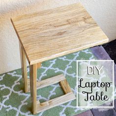 a small wooden table sitting on top of a rug