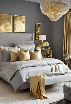 a bedroom with gray walls and gold accents