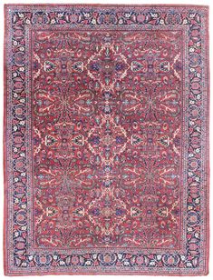 an antique persian rug with red, blue and pink colors on the center square area