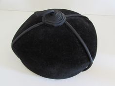 "This next item is wonderful, if you love vintage Hats with an added feature of being an Evelyn Varon Hat, well take a look. A Black Velvet with Black Satin with Satin accent is in impeccable condition, free of stains or any flaws. A Pillbox style, with four strips of Black Satin piping that meets at center of top, the four come to the center to create a beehive look with loop at top, very cute, simple but fancy. Pictures help to explain what I'm talking about. Clearly marked inside with origina Victorian Adjustable Hat For Church, Vintage Costume Cap One Size Fits Most, Adjustable Vintage Cloche Hat, Vintage Bonnet With Adjustable Short Brim, Vintage Adjustable Bonnet With Short Brim, Vintage Flat Cap For Formal Occasions, Vintage Short Brim Bonnet With Adjustable Fit, Victorian Adjustable Cloche Hat, Vintage Flat Cap For Parties