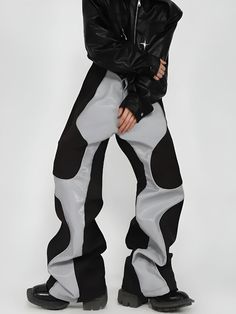 Step into the future of fashion with these cyberpunk-inspired wide-leg pants. Boasting unique patchwork details and a secure zip and button fastening, they are a statement piece for men. Ideal for festivals, parties, or a bold streetwear ensemble, these pants encapsulate the Y2K vibe. Cyberpunk aesthetic Patchwork detail at front Faux leather Zip & button fastening Men's pants Our model wears S and is 6'9 (177cm) Cyberpunk Baggy Bottoms For Streetwear, Cyberpunk Cargo Pants For Streetwear, Urban Patchwork Pants For Streetwear, Cyberpunk Parachute Pants With Pockets For Streetwear, Aesthetic Patchwork, Black Cotton Cyberpunk Pants, Aesthetic Clothing Stores, Super Suit, Future Of Fashion