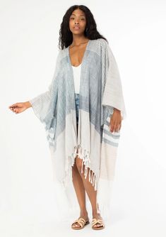 Summer Bohemian Beach Maxi Kimono with frayed detailing and striped pattern. White colored with Blue striped detailing. Striped Kaftan For Summer Beach Cover-up, Bohemian Long Sleeve Cover-up For Warm Weather, Long Sleeve Bohemian Cover-up For Warm Weather, Spring Cotton Cover-up For Warm Weather, Bohemian Striped Long Sleeve Kaftan, Striped Long Sleeve Bohemian Kaftan, Spring Beige Cotton Kaftan, Beige Cotton Kaftan For Spring, Spring Striped Kaftan For Beach Cover-up