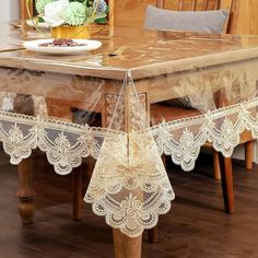 the table is covered with lace and flowers