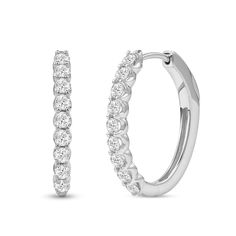 Achieve a most sophisticated look with these diamond oval-shaped hoop earrings. 10K white gold Each oval-shaped hoop features 1/20 ct. diamonds sparkling along the front edge 1 ct. t.w. of diamonds Hinged backs Timeless Oval White Gold Hoop Earrings, Oval Diamond White Hoop Earrings Fine Jewelry, Diamond White Oval Hoop Earrings With Prong Setting, Oval Diamond Hoop Earrings In White Gold, White Gold Diamond Hoop Earrings With Oval Shape, Oval Hoop Earrings In Diamond White With Brilliant Cut, White Gold Oval Diamond Hoop Earrings, Classic Oval Cubic Zirconia Hoop Earrings, Oval White Gold Hoop Earrings With Prong Setting