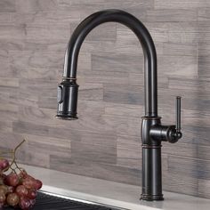 Embodying timeless elegance, the Sellette™ Traditional faucet brings you the best of both worlds by combining classic styling with a highly functional pull-down design. The dual-function sprayhead operates with a flexible hose and swivel adapter for an increased range of motion all around the sink. Includes an optional deck plate which allows you to install this single handle faucet with a 1, 2, or 3-hole sink. Kraus Sellette Oil Rubbed Bronze Single Handle Pull-down Kitchen Faucet | KPF-1682ORB Oil Rubbed Bronze Kitchen, Bronze Kitchen Faucet, Rubbed Bronze Kitchen, Oil Rubbed Bronze Faucet, Traditional Faucet, Bronze Kitchen, Faucet Design