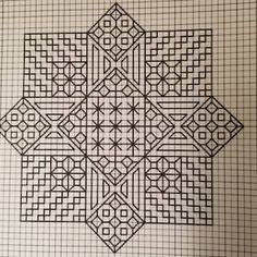 an intricate design is shown in the middle of a gridded paper with black lines