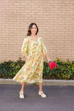 Add a pop of color to your wardrobe with our Aliyah Tie Front Puff Sleeve Midi Dress in Yellow. This beautiful dress features a playful tie detail, short sleeves, and a charming floral print. Perfect for a sunny summer day! Paired with THE GRETA PLATFORM LOAFERS IN BONE V-neck with tie string Midi length Puff sleeves Pockets Clean hem Lined Self: 100% Rayon, Lining: 100% Polyester Model is 5'5" wearing a small. Length (shoulder to hem): Small: 48”, Medium: 48.5”, Large: 49” To view our return policy click here! Happy Threads, Summer Goddess, Sunny Summer Day, Puff Sleeve Midi Dress, Swimming Outfit, Platform Loafers, Sleeve Midi Dress, Swim Bottoms, Summer Day