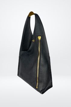 Tom Ford Large Single Strap Hobo Bag w Gold Hardware – Kit's Boutique Luxury Evening Hobo Bag With Zipper Closure, Black Bucket Bag With Gold-tone Hardware For Business, Black Hobo Bag With Palladium Hardware For Business, Black Business Bucket Bag With Gold-tone Hardware, Designer Hobo Tote Bag With Zipper, Luxury Hobo Tote Bag For Business, Luxury Top Handle Hobo Bag With Zipper, Luxury Black Hobo Bag With Removable Pouch, Luxury Hobo Bag With Top Handle And Zipper Closure