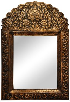 an ornate gold framed mirror with leaves on it's sides and a flower design