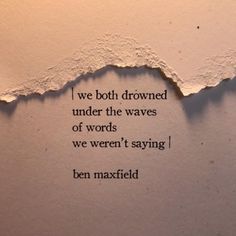 a torn piece of paper with the words we both drown under the waves of words