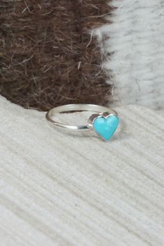 This turquoise and sterling silver heart ring was made by Zuni silversmith A Laio.Size: 5.25Length: 1/4"Width: 1/4"Free shipping on all orders! We ship with USPS and always include tracking. All orders ship within a day of payment.Returns are accepted up to 30 days after you receive your order. Just send us a message. Our shop offers cash back or store credit. The item must be returned in new condition. Handmade Blue Heart Ring Gift, Handmade Blue Heart Ring For Gift, Heart-shaped Turquoise Blue Ring For Gift, Heart-shaped Blue Turquoise Ring For Gift, Heart-shaped Blue Turquoise Ring Gift, Heart-shaped Turquoise Ring For Anniversary, Heart-shaped Turquoise Sterling Silver Ring, Heart-shaped Turquoise Ring As Gift, Handmade Turquoise Heart-shaped Ring