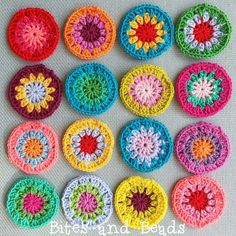 crocheted circles are arranged in different colors and sizes, with the center surrounded by smaller ones