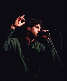 a man holding a microphone in front of his face