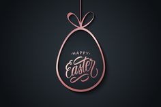 an easter egg with the words happy easter hanging from it's side on a black background