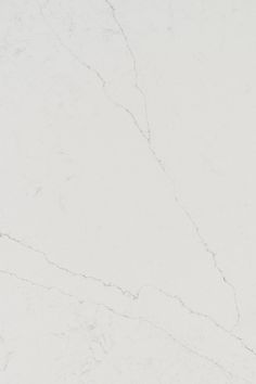 a white marble textured surface with no visible cracks in the middle and one missing