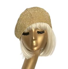 This handmade Gold Metallic Beret Hat is the ultimate fashion statement with its stunning lurex material. Its silky gold satin lining not only adds a touch of luxury, but also helps fight frizz for gorgeous hair. Featuring a comfortable 1" elastic band, this beret is the perfect addition to any outfit. Made in the USA. 6 section crown 1" soft elastic white band inside One size fits most up to 22" Made in USA Dry Clean only Trendy Gold Cap, Elegant Flat Cap For Party, Gold Cap Hat One Size Fits Most, Adjustable Flat Cap For Parties, Adjustable Flat Cap Mini Hats For Party, Gold Cap Hat As Gift, Gold Party Hat For Winter, Gold Gatsby Hat With Adjustable Fit, Gold Chic Fitted Fascinator