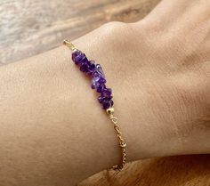 Gorgeous eye catching raw Amethyst chip stones thread in dainty gold or silver chain. Normal bracelet length is 7 inches. Options: Adjustable back 1 inch Ex: If you get a 6in the total length is 6 inch and able to adjust back 1 inch to 5 inch and in between (5-6in) 6 in 7in 8 in 9 in Simple, Dainty, Delicate, yet so Elegant and Romantic. The shine and color are so gorgeous. The picture does not do its justice the piece is so much prettier in person. Perfect for birthday, Christmas, mother's day, Normal Bracelet, Raw Stone Bracelet, Birthstone Bracelet, Raw Amethyst, Crystal Dangle Earrings, Silver Chain Bracelet, Birthstone Bracelets, Amethyst Bracelet, February Birthstone