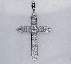 This exquisite 18K White Gold Cross Pendant effortlessly radiates elegance and luxury. Crafted from gleaming white gold and embellished with pointed tips for added refinement, it is the perfect piece of jewelry to add a touch of sophistication to any outfit. Luxury Diamond White Crucifix Jewelry, Luxury Single Cut Diamond Cross Jewelry, Luxury White Diamond Accents Cross Necklace, Luxury Diamond White Brilliant Cut Cross Necklace, Luxury White Cross Necklace With Diamond Accents, Luxury Diamond White Elegant Cross Necklace, Luxury White Gold Cross Necklace Gift, Luxury White Diamond Cross Necklace, Luxury Diamond White Cross Pendant