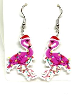 These cute Christmas Flamingo Earrings feature a bright pink flamingo wrapped up in Christmas lights and wearing a Santa hat.  Makes a great gift for your flamingo loving friends. Adjustable Pink Holiday Jewelry, Adjustable Pink Jewelry For Holiday, Handmade Pink Jewelry For Holiday, Pink Adjustable Christmas Jewelry, Christmas Flamingo, Earrings Bird, Flamingo Earrings, Flamingo Christmas, Pensacola Fl