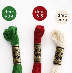 three spools of red, white and green thread with the same color on them