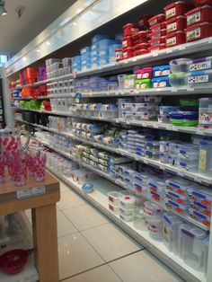 shelves in a grocery store filled with lots of different types of food and containers on them