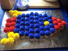 a cake made to look like the colors of the american flag is on top of tin foil