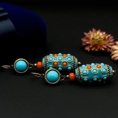 Product Details: Vintage Ethnic Turquoise Thangka Earrings; Length: 65 mm; Width: 16 mm; Weight: 32 grams; Material: Copper (18K Gold Plated), Turquoise, Enamel; Handmade with Vintage Craftsmanship; Comes with a Gift Box. Customer Service: Should you have any questions, please leave a message, and I am more than happy to assist you. Additionally, if you are not satisfied with your purchase, please do not hesitate to reach out to me. About Us: We are enthusiasts of traditional craftsmanship and h Handcrafted Art, Turquoise Earrings, Ethnic Fashion, Vintage Earrings, Favorite Things List, 18k Gold, Jewelry Earrings Dangle, Etsy Earrings, Dangle Drop Earrings