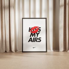 a black and white poster with the words kiss my airs on it in front of curtains