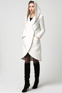 The design of this wool midi coat is simple yet dramatic at the same time with its oversized draped hood. The fold over flap closure is nicely accented by the scalloped, drop hem design for a unique, asymmetrical look. Lightweight but warm, the coat is fully lined in polyester and features two side pockets.DETAIL 50% w Wrap Coat Outfit, White Wool Coat, Wool Wrap Coat, Beige Coat, Wool Clothing, Womens Jackets, Wrap Coat, White Coat, Coat Outfits