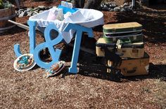 several suitcases stacked on top of each other in the dirt