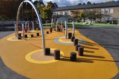 an empty playground in the middle of a residential area