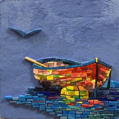 a painting of a colorful boat on the side of a building with blue bricks and yellow sticks sticking out of it